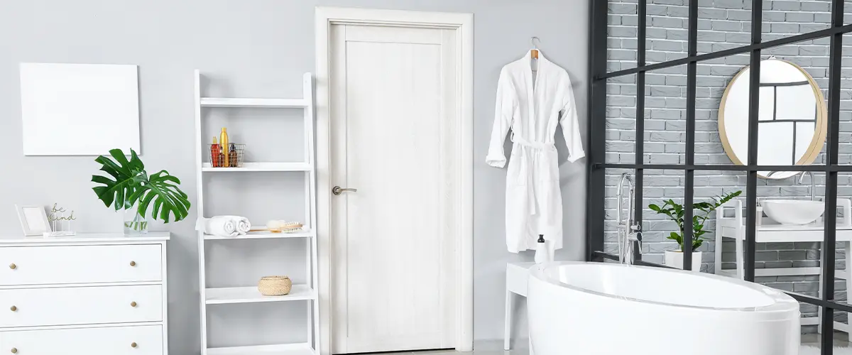 bathroom entrance with white panel door