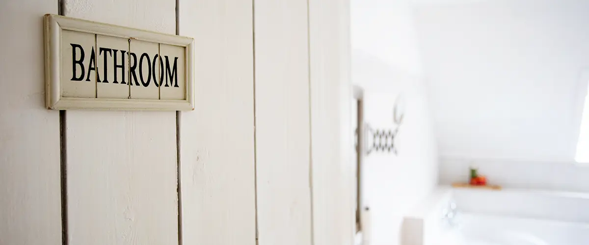 Closeup bathroom door with sign bathroom shallow depth of field