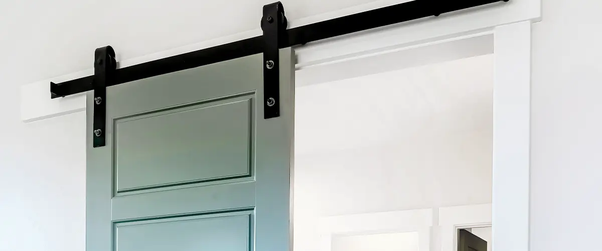 top side of green sliding door rails