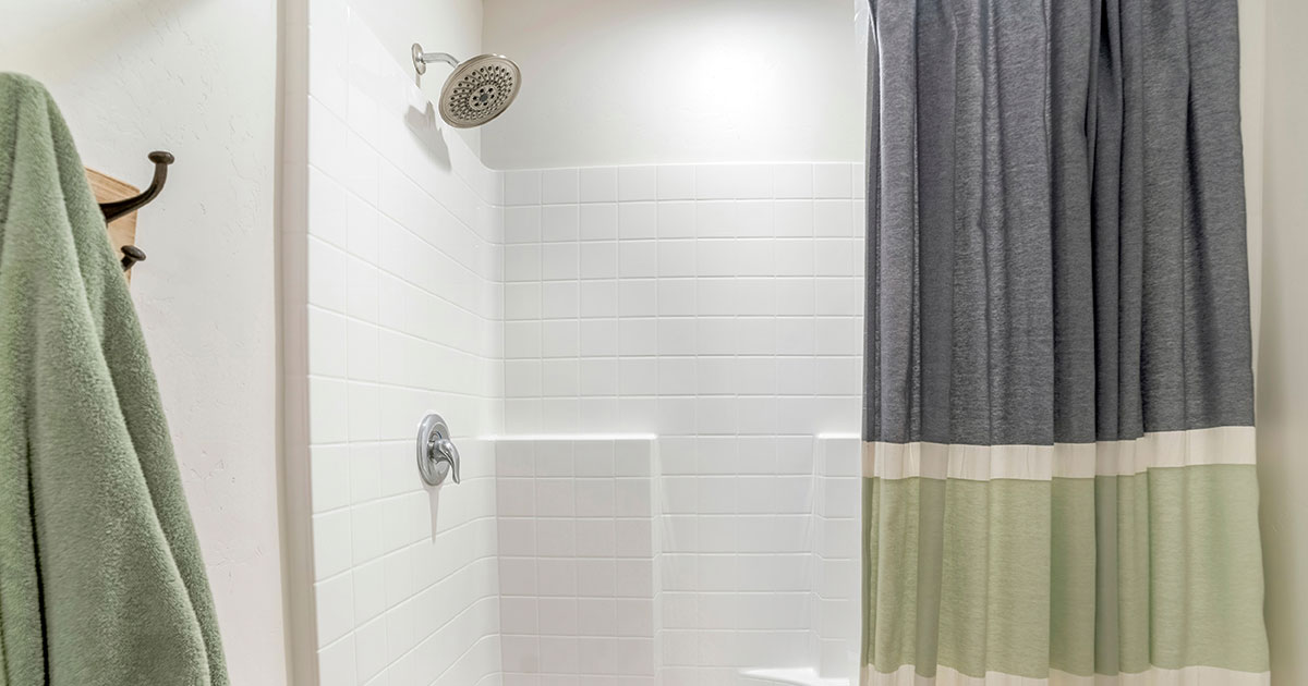 acrylic vs tile shower