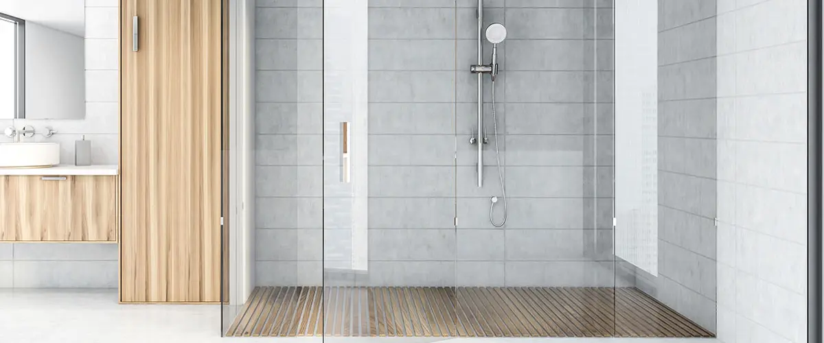 White tile bathroom interior with shower